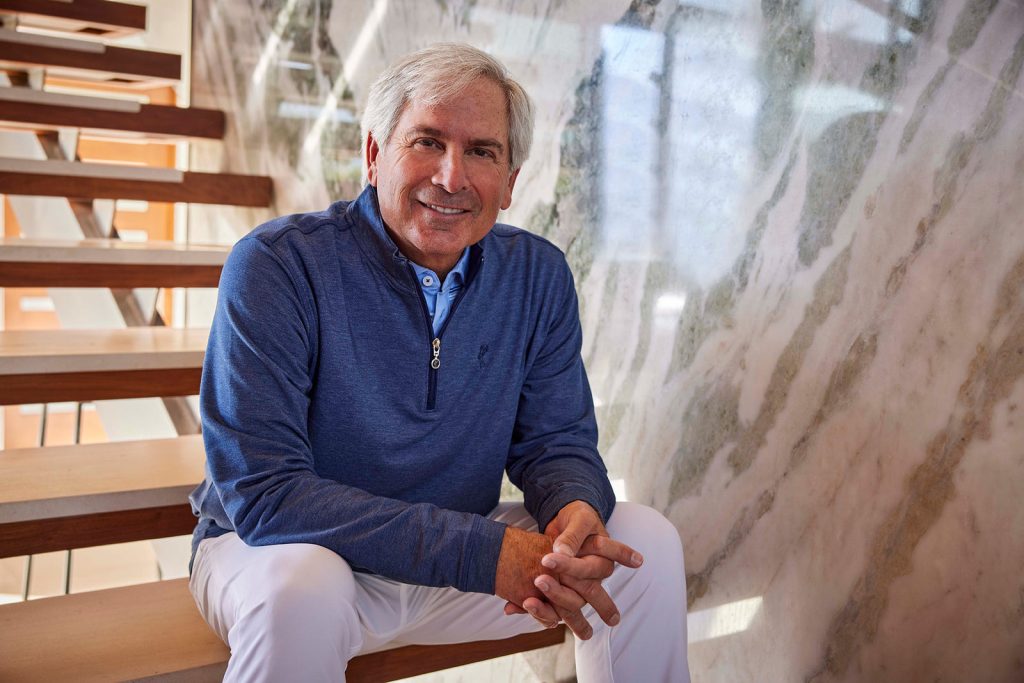 Fred Couples sitting on steps